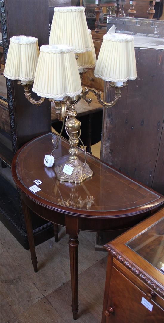 Cast gilt metal four branch candelabrum and a D shaped side table (2)